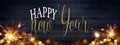 HAPPY NEW YEAR / NEW YEAR`S EVE 2023 background greeting card - Frame of lights bokeh golden flares and sparkler isolated on Royalty Free Stock Photo