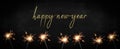 HAPPY NEW YEAR, New Year`s Eve Silvester Party festive background banner panorama greeting card - Many burning sparkler in the