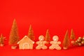 Happy New Year`s 2022 set of gingerbread man in face mask and house from ginger biscuits on classic traditional red background, Royalty Free Stock Photo