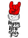 Happy new year. Santa Claus hand with rock and roll sign.