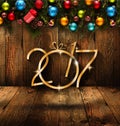 2017 Happy New Year seasonal background with real wood green pine, colorful Christmas baubles, gift boxe and other seasonal stuff Royalty Free Stock Photo