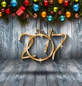 2017 Happy New Year seasonal background with real wood green pine, colorful Christmas baubles, gift boxe and other seasonal stuff Royalty Free Stock Photo