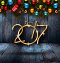 2017 Happy New Year seasonal background with real wood green pine, colorful Christmas baubles, gift boxe and other seasonal stuff Royalty Free Stock Photo