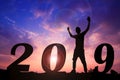 Happy new year Silhouette sunset background. A man standing instead number 1 word