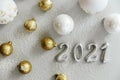 Happy New Year 2021. Silver digits 2021 with christmas hat are on white background. Holiday Party Decoration or postcard Royalty Free Stock Photo