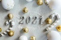 Happy New Year 2021. Silver digits 2021 with christmas hat are on white background. Holiday Party Decoration or postcard Royalty Free Stock Photo