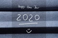 2020 Happy new year card with numbers and text on navy blue background