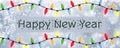 Happy New Year - A snowflake background banner with multiple colour Christmas Tree lights Royalty Free Stock Photo