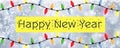 Happy New Year - A snowflake background banner with multiple colour Christmas Tree lights Royalty Free Stock Photo