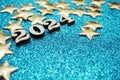 Happy New year 2024 with space copy on blue glitter background