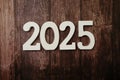 2025 Happy New Year with space copy on wooden background