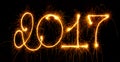 Happy New Year - 2017 with sparklers on black Royalty Free Stock Photo