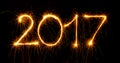 Happy New Year - 2017 with sparklers on black Royalty Free Stock Photo