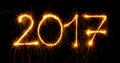 Happy New Year - 2017 with sparklers on black Royalty Free Stock Photo