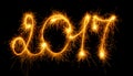 Happy New Year - 2017 with sparklers on black Royalty Free Stock Photo