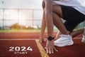 Happy new year 2024 Sport man runner running into the new year 2024. Start up of close up foot shoes jogging at stadium go to Goal Royalty Free Stock Photo