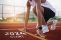 Happy new year 2024 Sport man runner running into the new year 2024. Start up of close up foot shoes jogging at stadium go to Goal Royalty Free Stock Photo