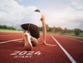 Happy new year 2024 Sport man runner running into the new year 2024. Start up of close up foot shoes jogging at stadium go to Goal Royalty Free Stock Photo