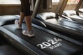 Happy new year 2024,2024 symbolizes the start of the new year. Close up of feet, sportswoman runner running on treadmill in