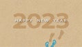 Happy new year 2023 text,footprint and sandal on brown sand beach background.Vector top view foot steps walking forward on sea