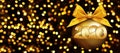2020 Happy New Year text with golden christmas ball and ribbon bow isolated on blurred lights Background for Flyers and Greetings