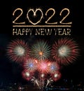 Happy New Year 2022 text hand written sparkles fireworks with Colorful fireworks of various colors at night Royalty Free Stock Photo