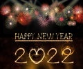 Happy New Year 2022 text hand written sparkles fireworks with Colorful fireworks of various colors at night Royalty Free Stock Photo