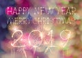 Happy New Year 2019 text hand written sparkles fireworks with Colorful fireworks of various colors at night Royalty Free Stock Photo