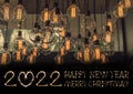 Happy New Year 2022 text hand written sparkles fireworks with Vintage Lighting decor for building interiors Royalty Free Stock Photo