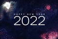 Happy New Year 2022 Text Holiday Celebration Graphic with Fireworks Background in Night Sky Royalty Free Stock Photo