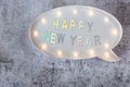 Happy New Year text in lightbox on grey minimalistic background Royalty Free Stock Photo