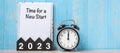 2023 Happy New Year with Time for a New start, black retro alarm clock and wooden number.Resolution, Goals, Plan, Action and Royalty Free Stock Photo