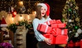 Happy New Year to you. Girl in santa claus hat. Christmas shopping. Christmas tree. Winter holiday. Sexy woman with Royalty Free Stock Photo