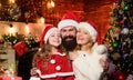 Happy New Year to you. small child and parents in santa hat. lot of xmas present boxes. Portrait loving family. Happy Royalty Free Stock Photo