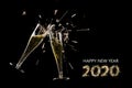 Happy new year 2020, two champagne flutes toast with splash and sparklers against a black background, party concept with text and Royalty Free Stock Photo