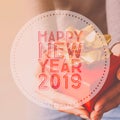 Happy New Year 2019, Typography on image hands holding gift box