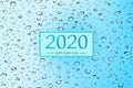 Happy new year 2020 with water droplet on blue background, Holiday greeting card