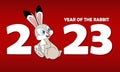 Happy new year 2023. White numbers with cute sitting rabbit on red background. Cartoon Rabbit as symbol of 2023 Chinese New Year. Royalty Free Stock Photo