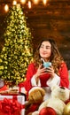 Happy new year. Woman enjoy cozy atmosphere. Decorate home. Xmas spirit. Happy girl at christmas tree. Family holiday Royalty Free Stock Photo