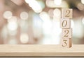 Happy New Year 2023 on wood cube block and blur abstract bokeh light background with cop space for text, Happy new year 2023 Royalty Free Stock Photo