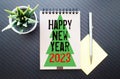 Happy New Year 2023 on wood cube block and blur abstract bokeh light background with cop space for text Royalty Free Stock Photo