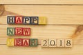 Happy new year 2018 wood cubes on wooden table cool Royalty Free Stock Photo