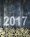 Happy New Year 2017 on a wooden background. Number 2017 on vintage style