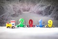 2019 happy new year,wooden toy train carrying numbers and Cristmas tree,covering snow Royalty Free Stock Photo