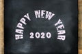 happy new year 2020 word displayed on chalkboard concept