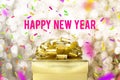 Happy new year word with Golden gift box with ribbon and colorful confetti at blur gold boekh light background,Winter holiday