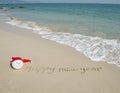 Happy new year written in beach Royalty Free Stock Photo