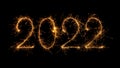 Happy New Year 2022 written with bengal fire, sparkler fireworks candle isolated on a black background Royalty Free Stock Photo