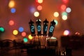 Happy new year is written with a lamp light. Radio electronic lamps. Original designed congratulation with a beautiful bokeh Royalty Free Stock Photo