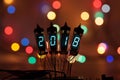Happy new year is written with a lamp light. Radio electronic lamps. 2018. Original designed congratulation with a Royalty Free Stock Photo